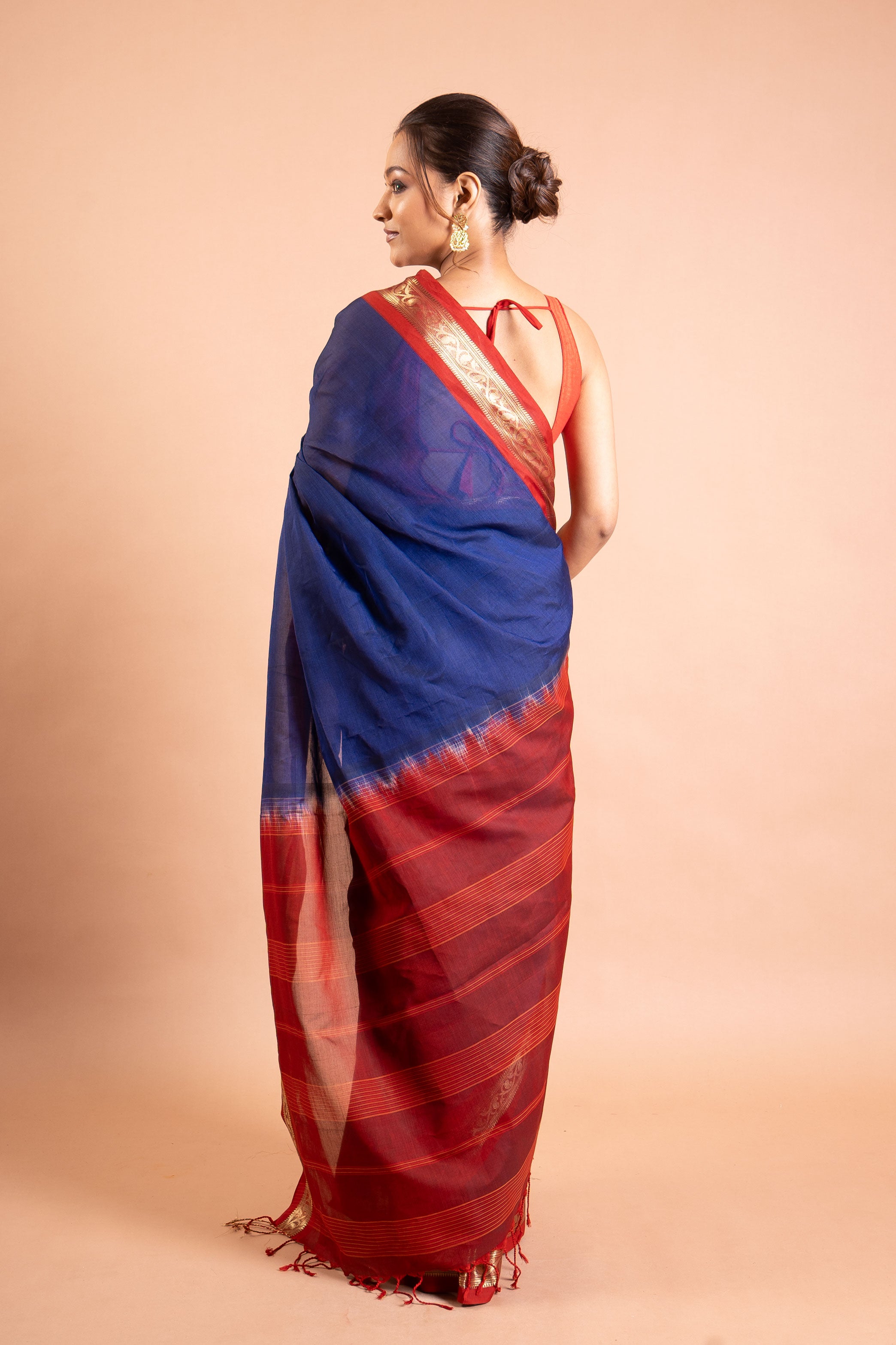 Neelanjali Navy–Red Zari Border Saree