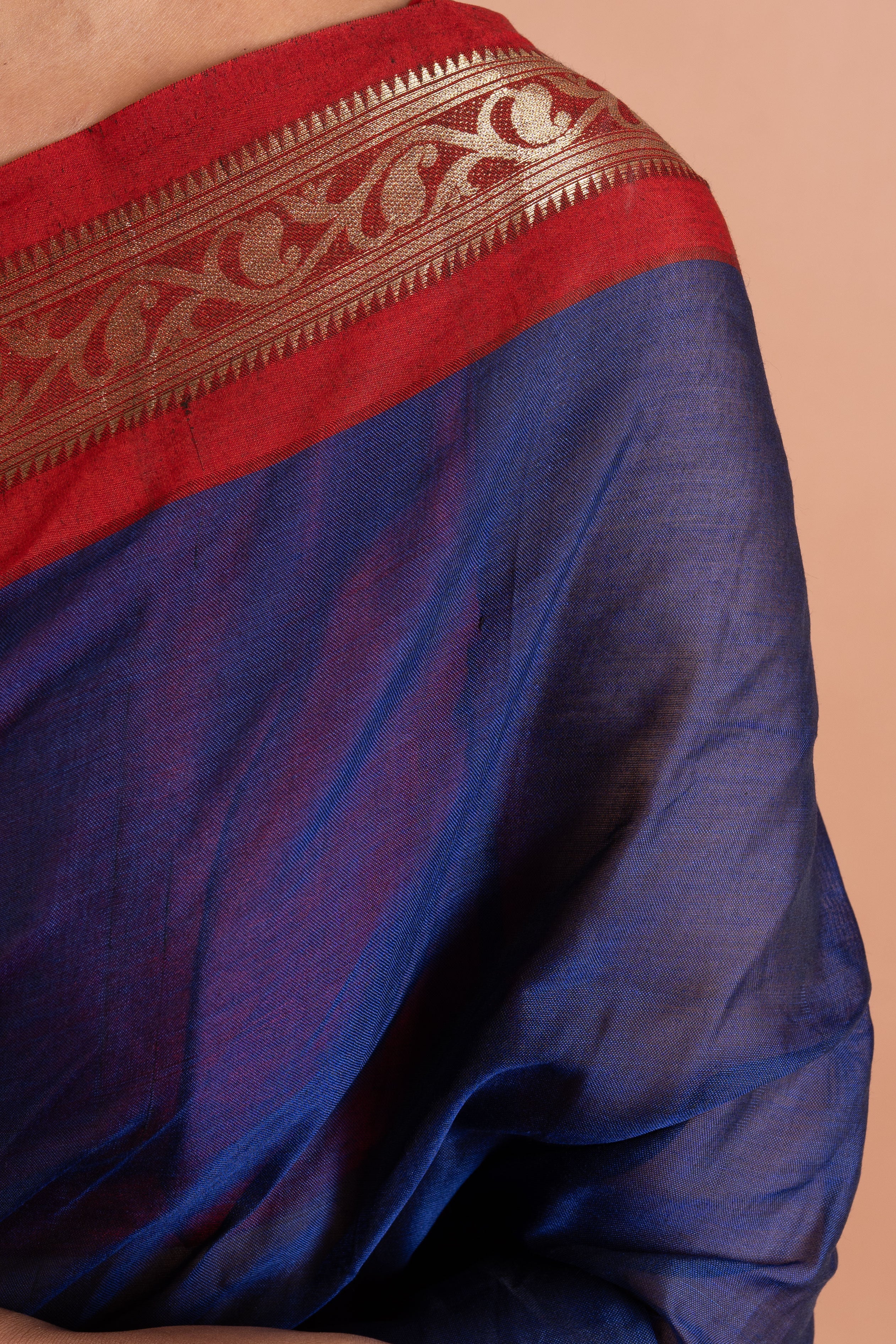 Neelanjali Navy–Red Zari Border Saree
