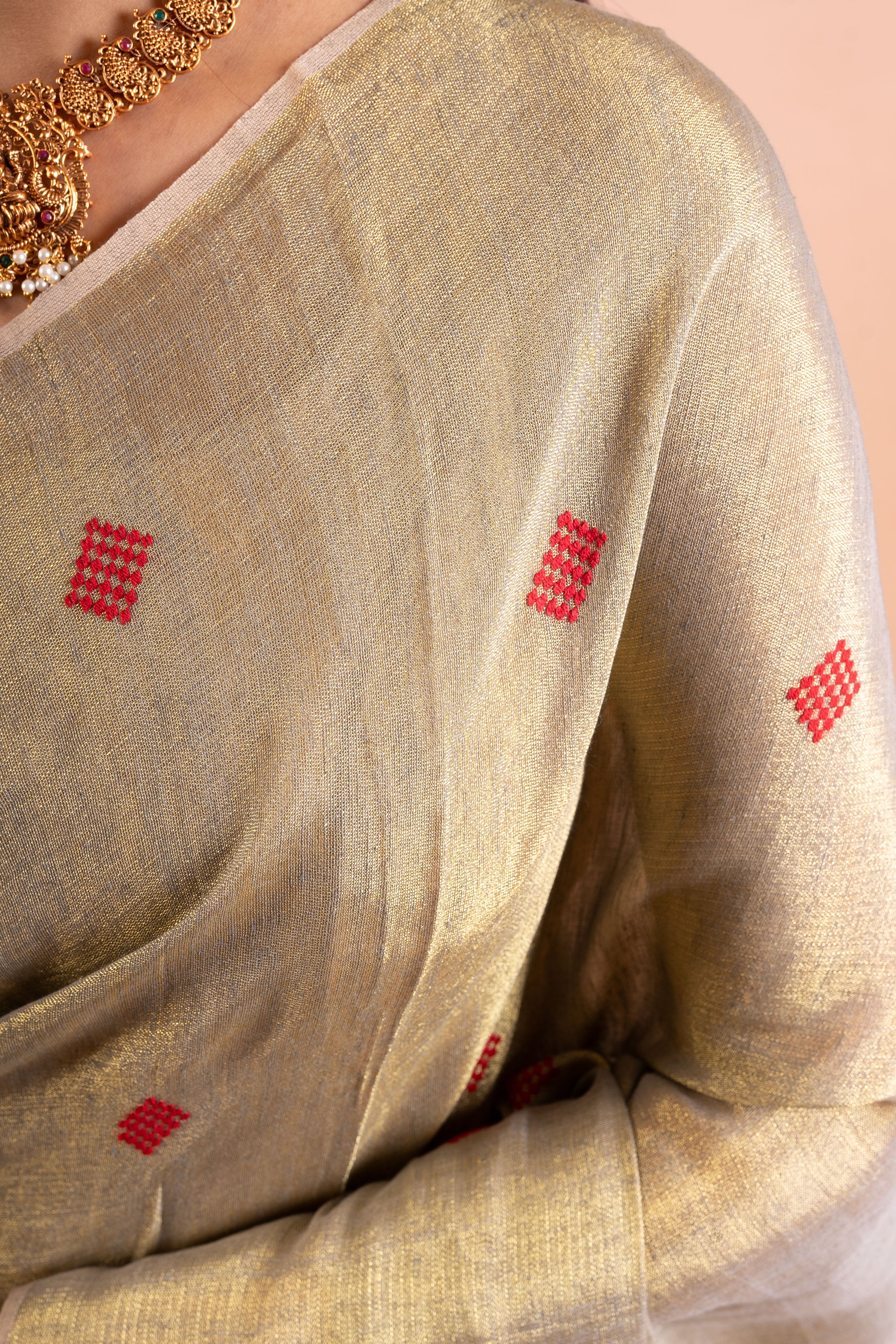 Champagne Gold Linen Tissue Saree with Red Butti & Tassels