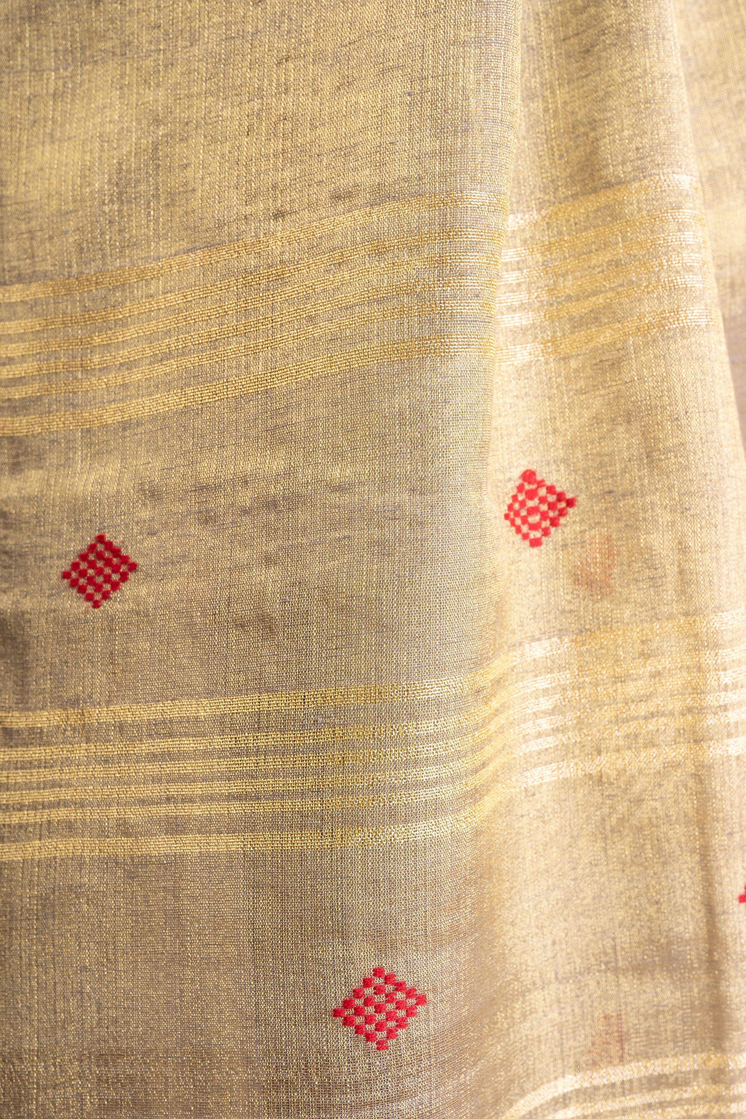 Champagne Gold Linen Tissue Saree with Red Butti & Tassels